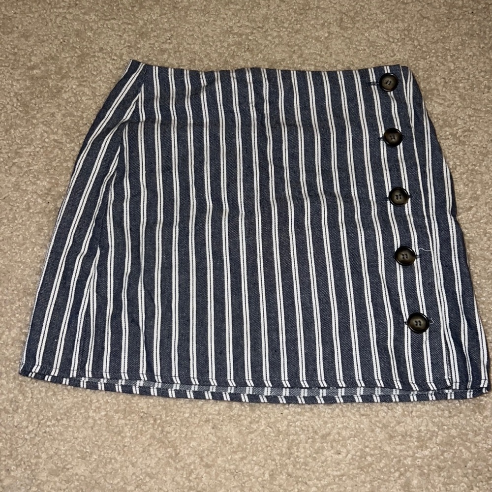 Navy blue striped mini skirt. It is in good condition and only worn a few times.